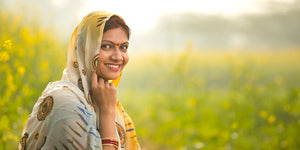 Indian women sitting in open field